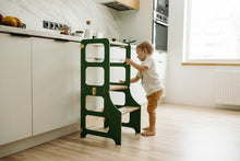 Last inn bildet i Galleri-visningsprogrammet, høystol grønn til barn på kjøkkenet
